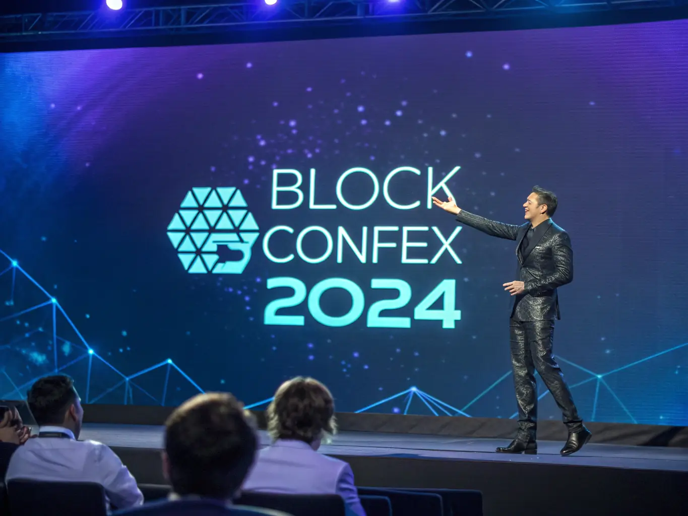 A professional shot of a keynote speaker presenting on stage at a blockchain conference in Cape Town, South Africa, with a focus on audience engagement.